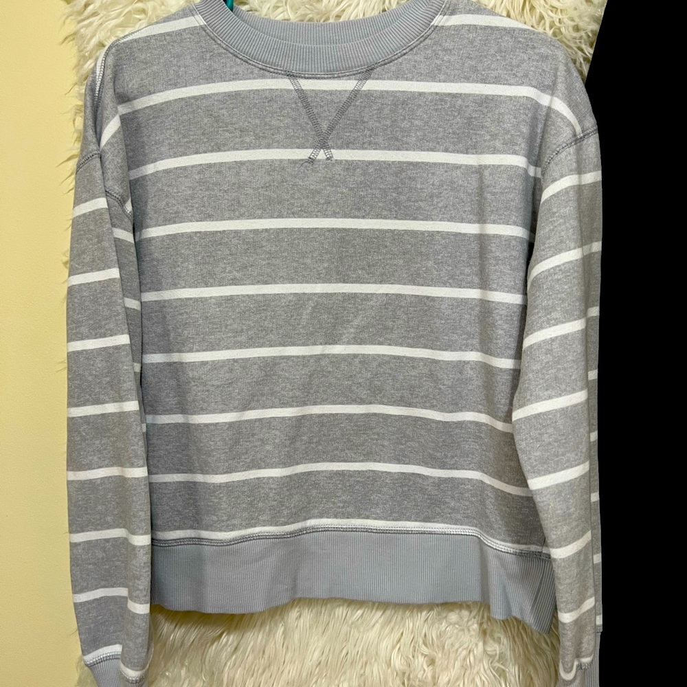 Selling this Grey/white strip long sleeve sweater.